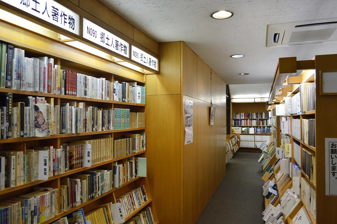 Aisle of bookshelves in a library